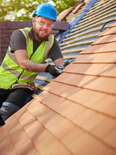 Roofing specialist installing new roof in Bristol