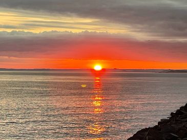 Sunrise over the sea, Weymouth. Photo by Kylie Clare.