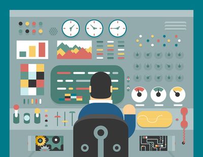 Man operating sophisticated control panel or console 