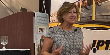 Karen Main speaking at the 2021 Iowa Pupil Transportation Association conference.