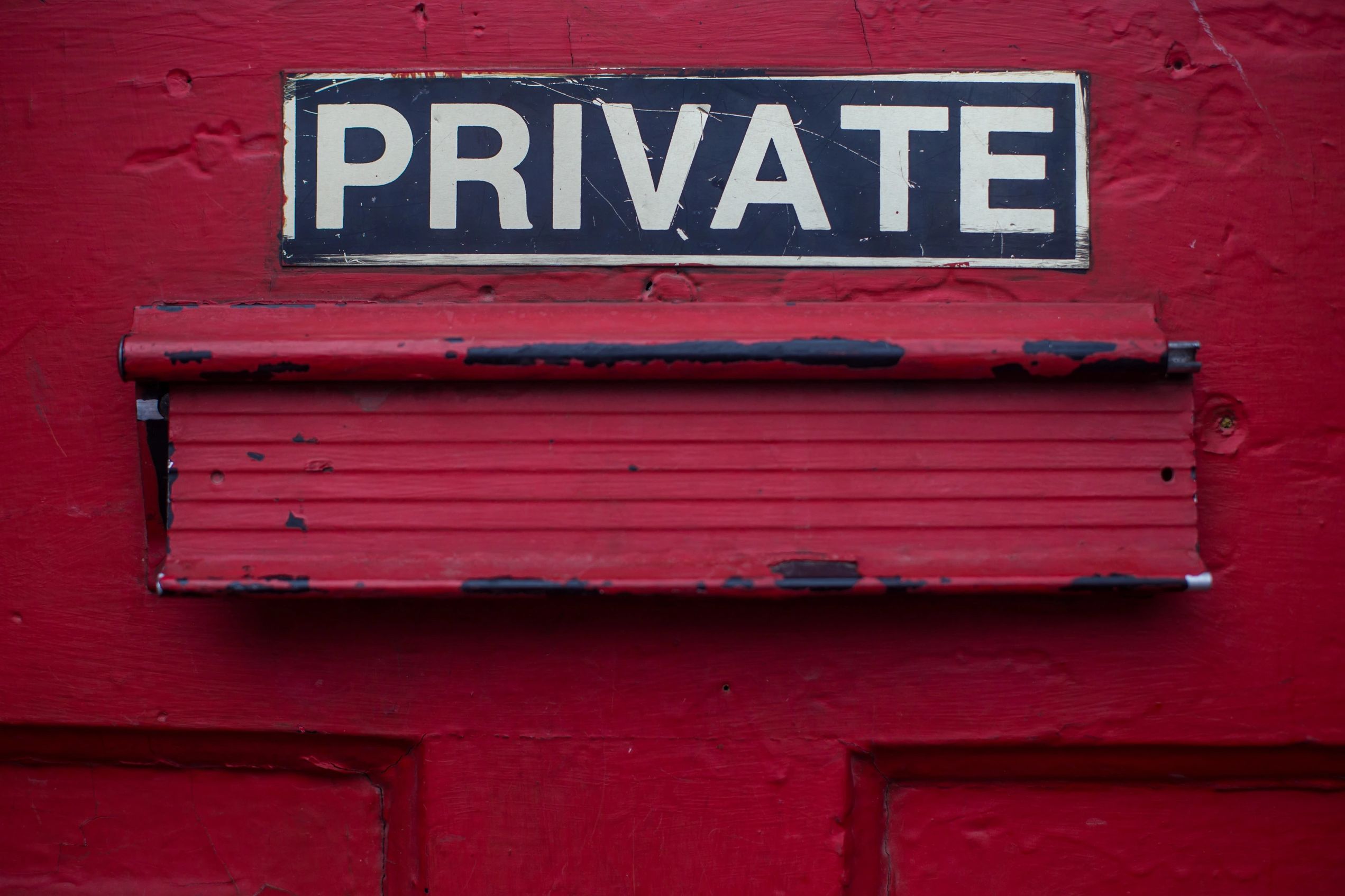 Privacy Policy represented by a red door with Private written on it.