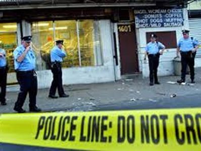 Police examining a crime scene waiting for the cleaners to arrive.