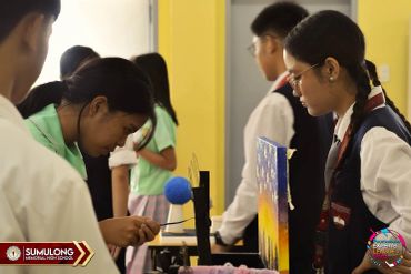 Students engaging in a science experiment in a school setting.