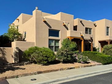 Modern southwestern-style house with desert landscaping.