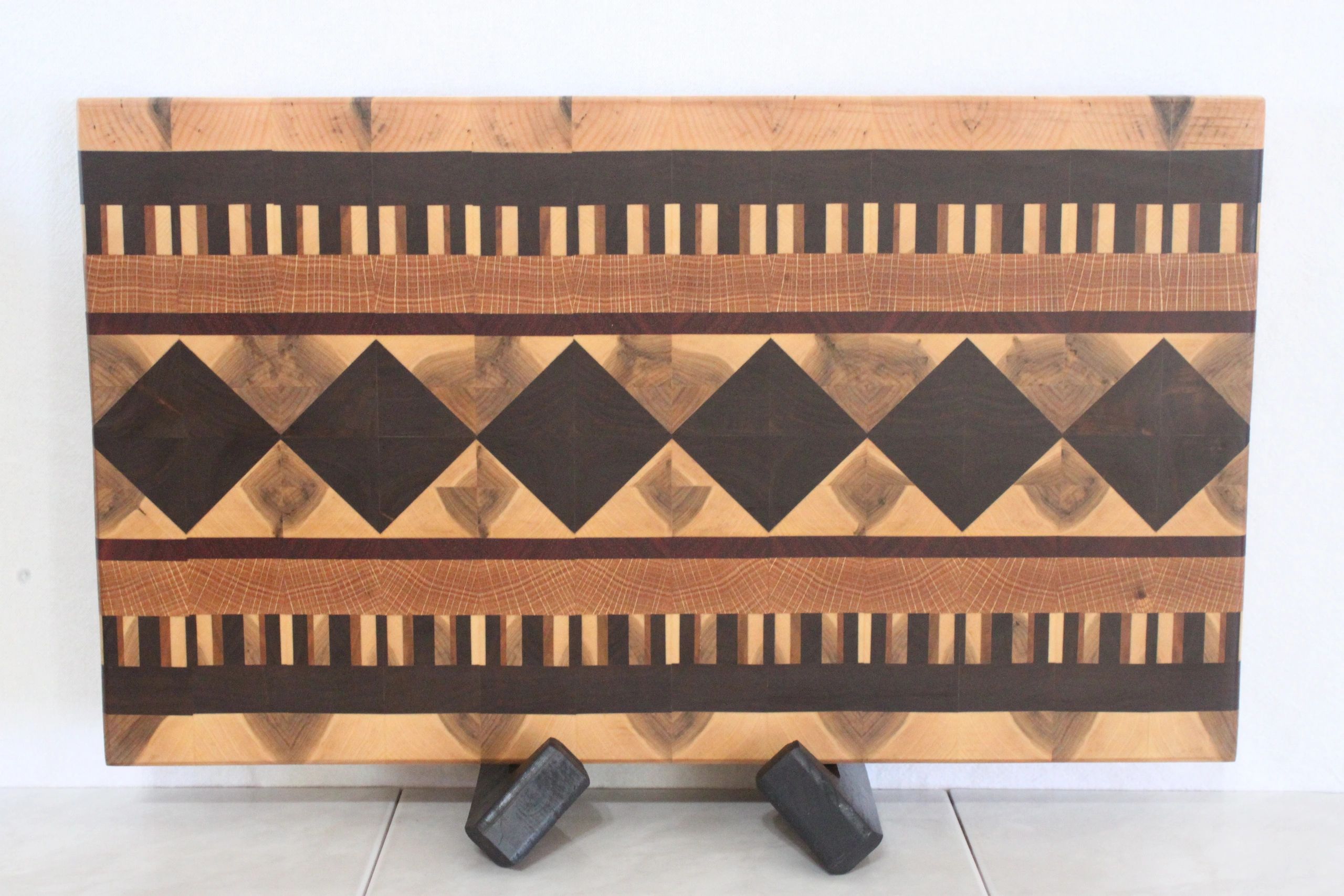 Navajo, end-grain made from walnut, oak, cherry, padauk and maple. Size 19 3/8  x 11 1/4  x 1 5/8