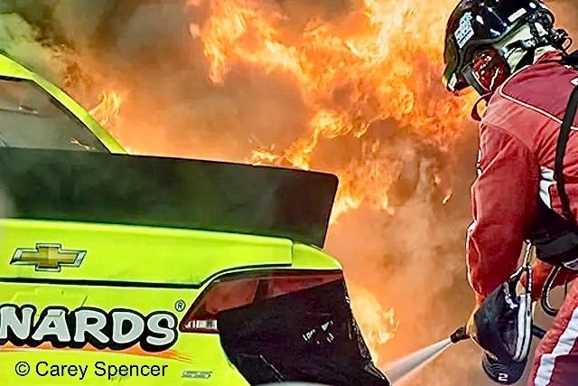 Menard's fiery NASCAR pit fire Homestead Miami  Flames surround sound the car