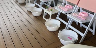 Pamper Party set up with beauty chairs in pink and white