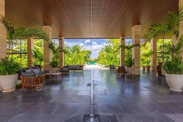 Open-air lobby and gathering space at AWA Playacar, blending modern design with tropical resort livi