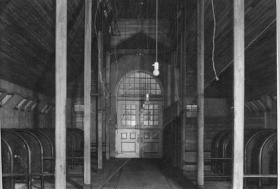 Photo of the interior of one of the quarantine barns in its original use