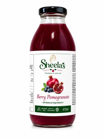 Bottle of Sheela's Berry Pomegranate juice with natural ingredients.