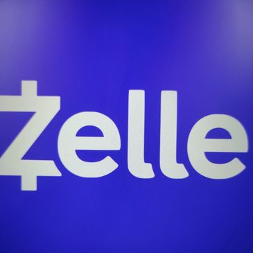 Close-up of the Zelle logo on a blue background.