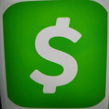 White dollar sign on green square background.