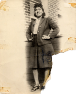 Vintage photo of a woman posing confidently.