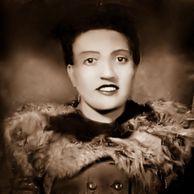 Vintage portrait of a woman in fur-trimmed coat.