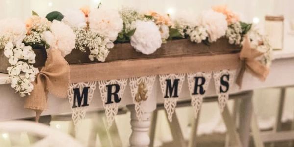 Wedding decoration with MR &amp; MRS sign and flowers.