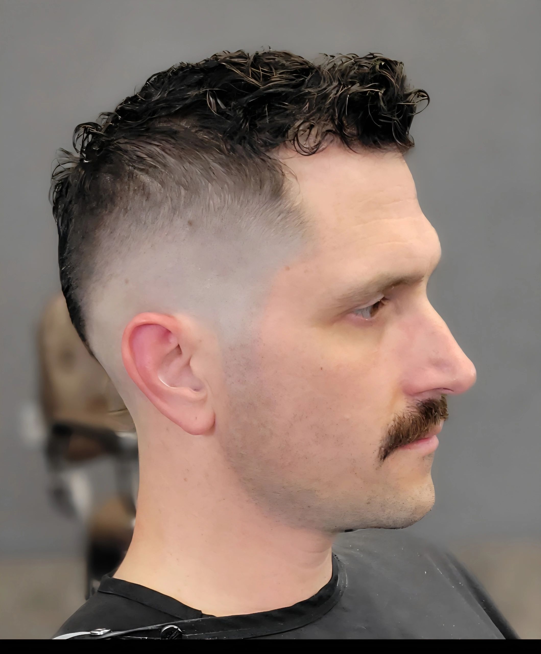 Mid-skin fade with precision beard grooming by Master Barber at Sharp & Faded in Fort Lauderdale.