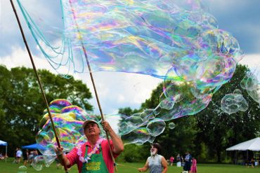 Grandpop Bubbles making giant bubbles at July 4th celebration in Pottstown, PA, before the storm. 