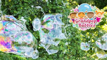 Grandpop Bubbles' colorful logo signals great fun for young families. Children make GIANT bubbles.