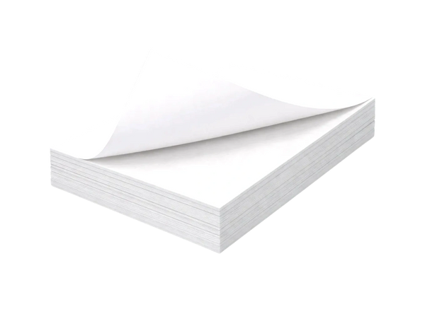A thick stack of blank white paper with one page partially turned.