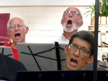 3 men really belting out the song