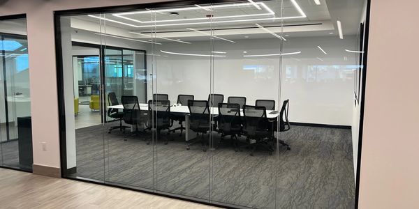 "Elegant glass architectural walls and conference room solutions offering modern aesthetics, soundproofing, and customizable designs to create open, collaborative, and professional environments."