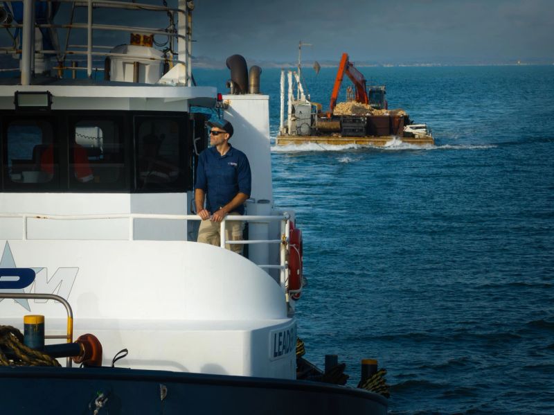 Marine biologist on barge at sea