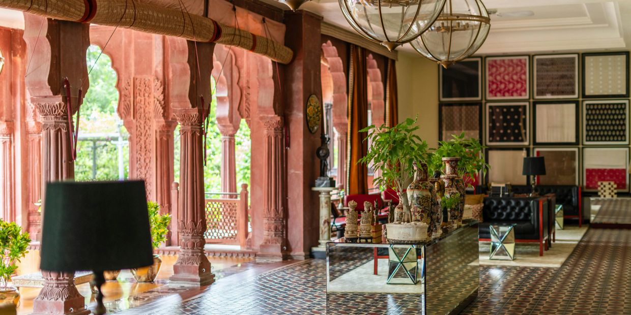 Elegant room with traditional red pillars and modern decor.