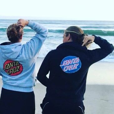 CALI's founders wearing their Santa Cruz hoodies.