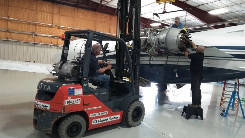 Employees working on aircraft maintenance