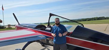 man standing in front of an airplane