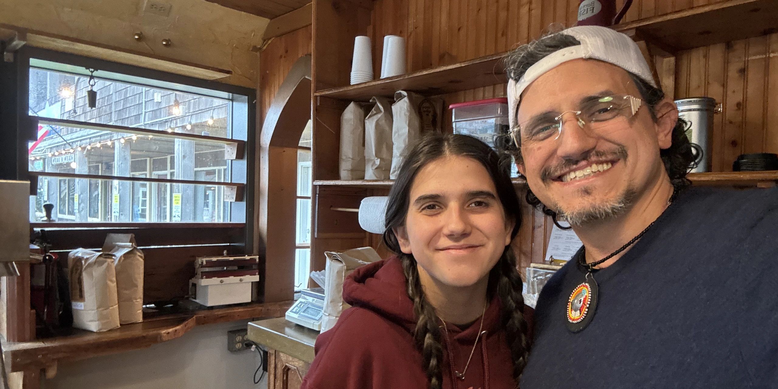 Lewellen Hunter and Indeara Daggett standing in front of the counter at kith+keel coffee.