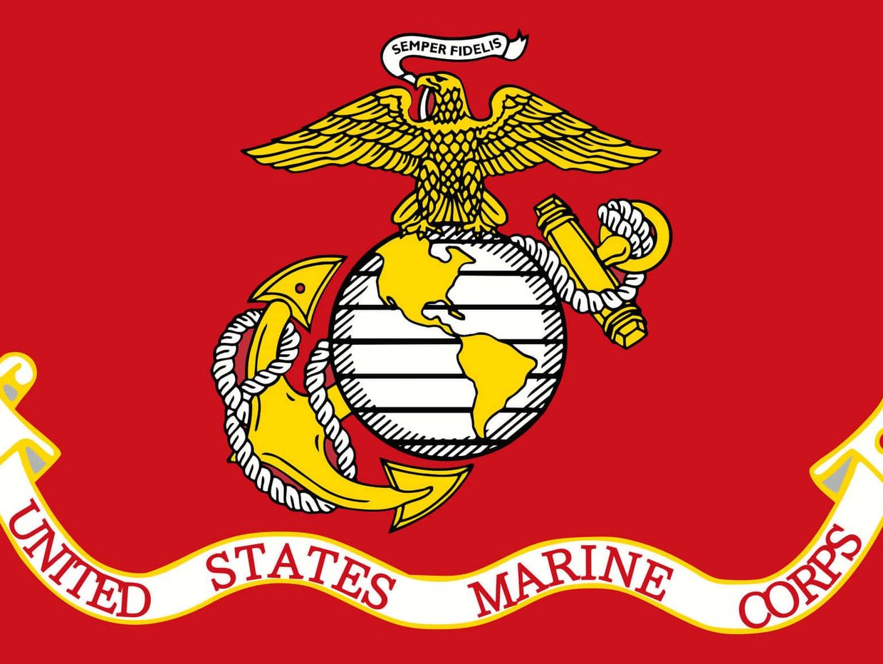 Emblem of the United States Marine Corps on a red background.