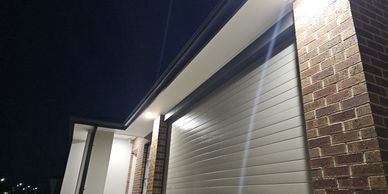 Led downlights mounted in the eave of the  front of the property. Switched by a movement sensor.
