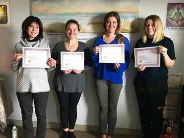 Woman holding their certificates