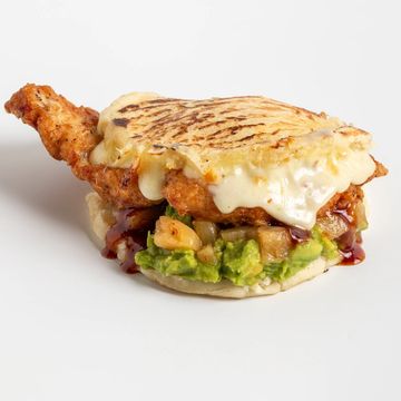 Grilled chicken sandwich with melted cheese and guacamole.