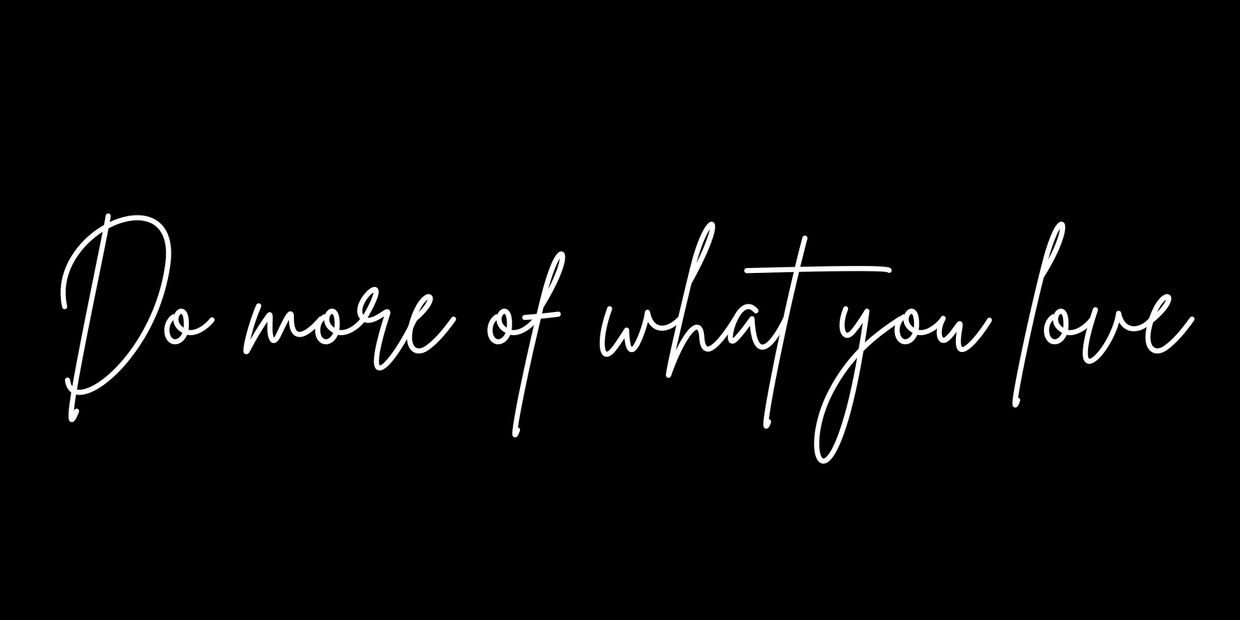 Inspirational quote saying, 'Do more of what you love' in elegant white script on black.