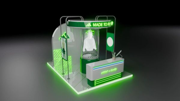Modern Adidas retail display booth with neon green lighting.