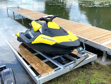 A speedboat parked beside a dock