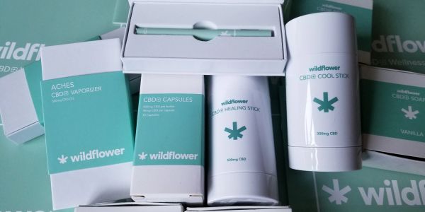 Wildflower CBD products including vaporizer, capsules, healing stick, and cool stick.
