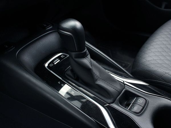 Automatic gear shift in car interior.