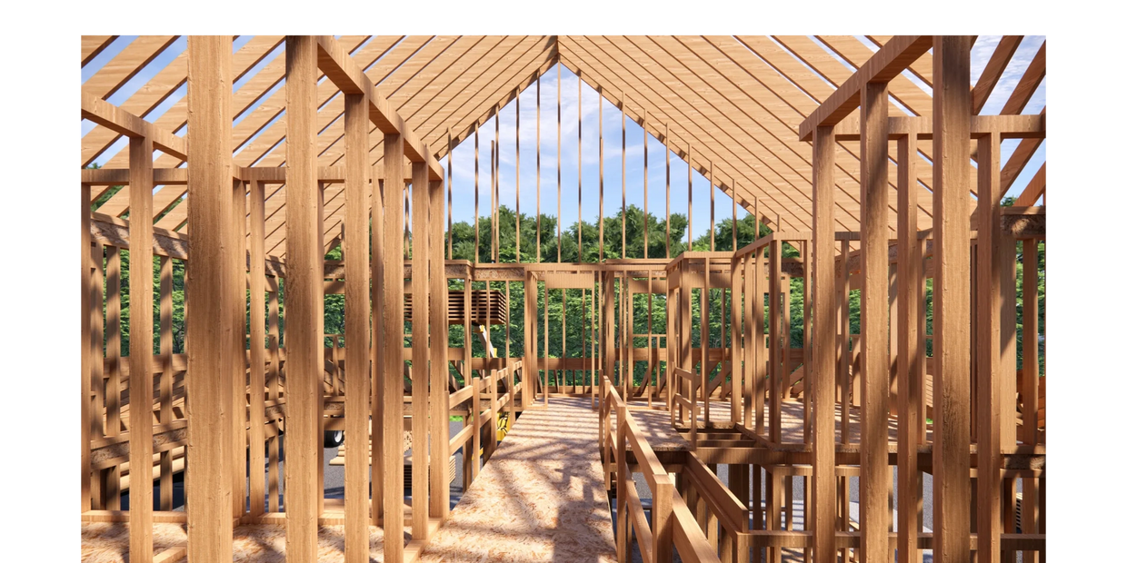 Wooden framework of a house under construction on a sunny day.