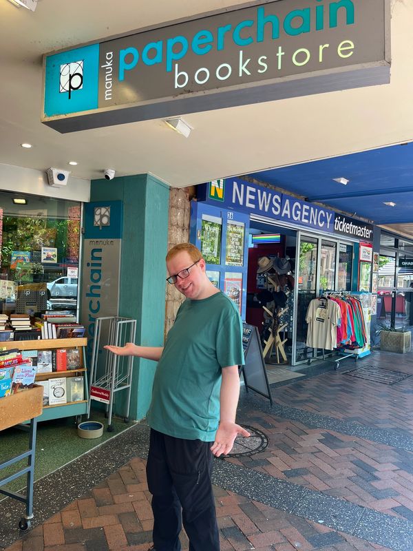 Liam standing outside the Paperchain Bookstore in Manuka ACT.