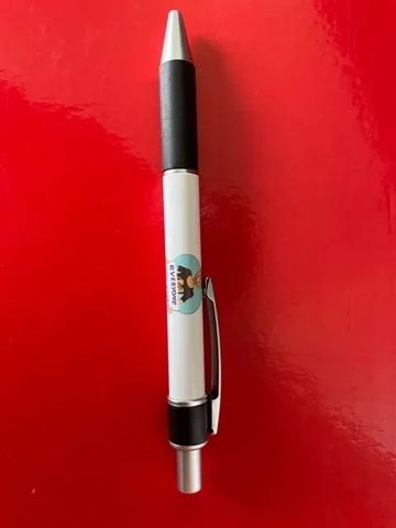 Pen with logo on it.