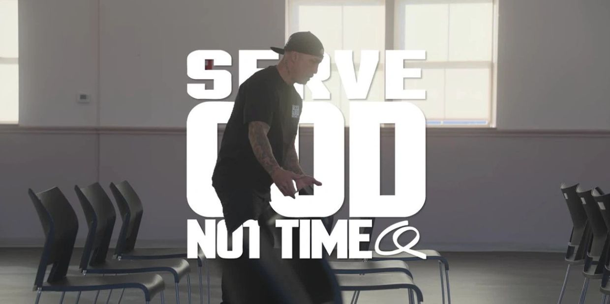 Man arranging chairs with text 'Serve God Not Time' overlay.