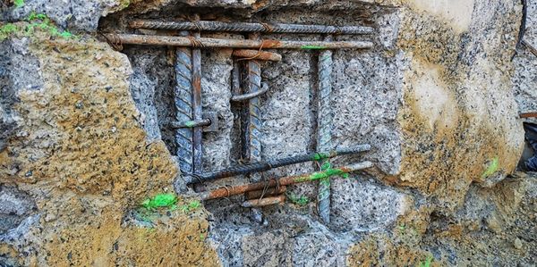 Damaged concrete retaining wall requiring remedials