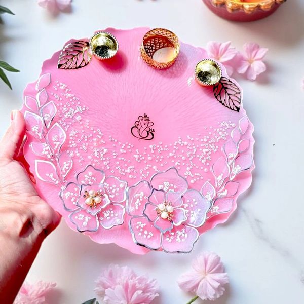 Buy Customized resin art product like Decorative pink pooja thali with floral designs, rings for festive occasions like Diwali.