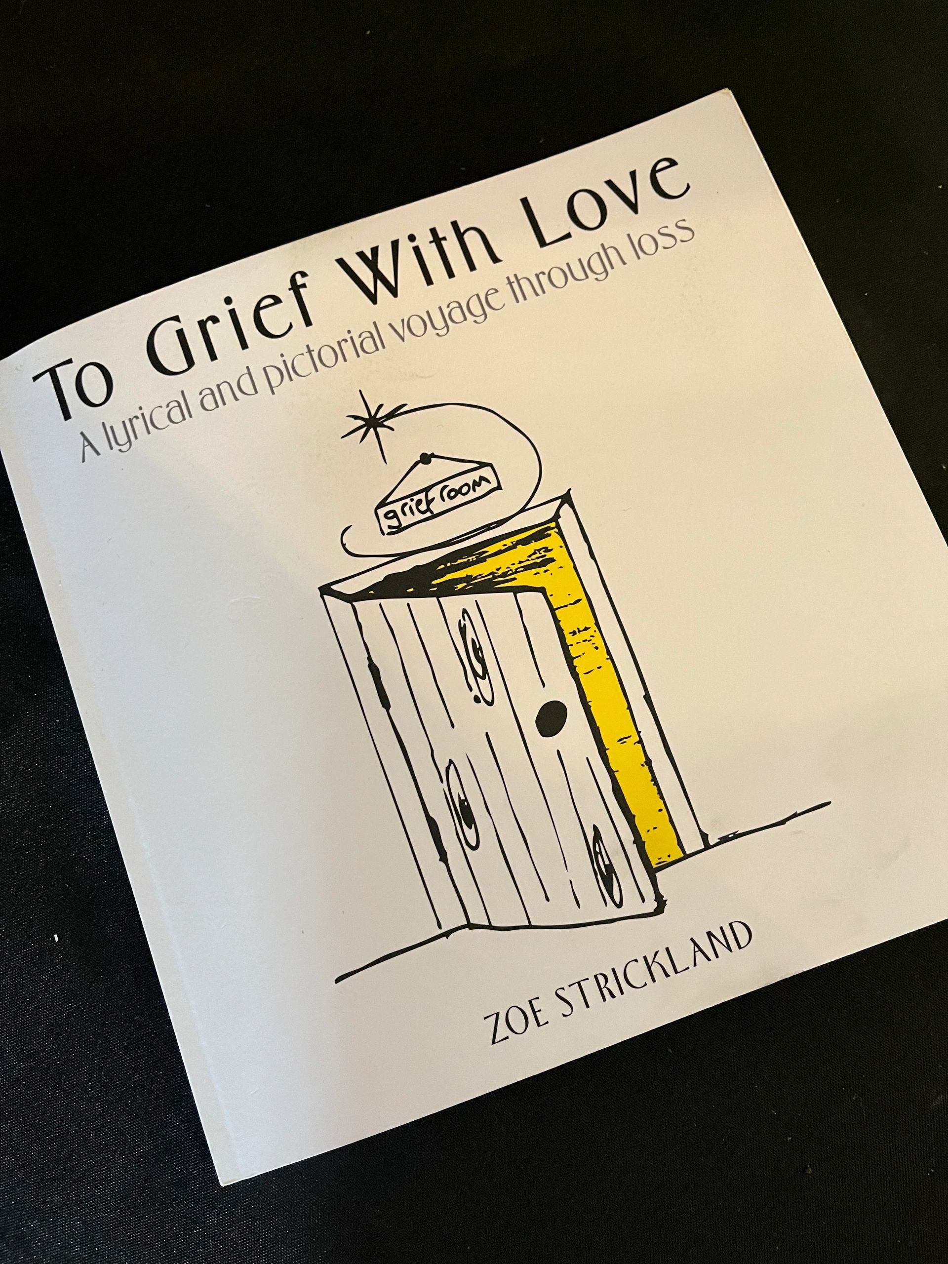 Book titled 'To Grief With Love' by Zoe Strickland with a door illustration.