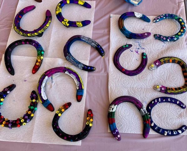 painted horse shoes craft from a child's birthday party
