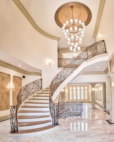 Custom home build interior design with large chandelier by Alex The Builder in Buckhead, Georgia