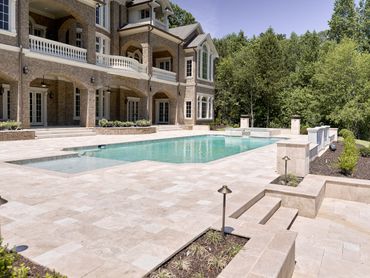 Custom home build with a pool and outdoor entertainment by Alex The Builder in Buckhead, Georgia